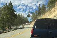 Air Rescue 5 airlifts a traffic accident victim from a tight spot on Angeles Crest Highway.