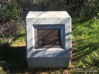 Marker recognizing the significant contributions from Governor Arnold Schwarzenegger and Betty Weider in the creation of the Backbone Trail