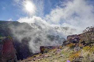 Clouds spilling over the lip of Boney Mountain's western escarpment.