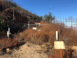 Barrier marking the private property line on Castro Peak Mtwy fire road