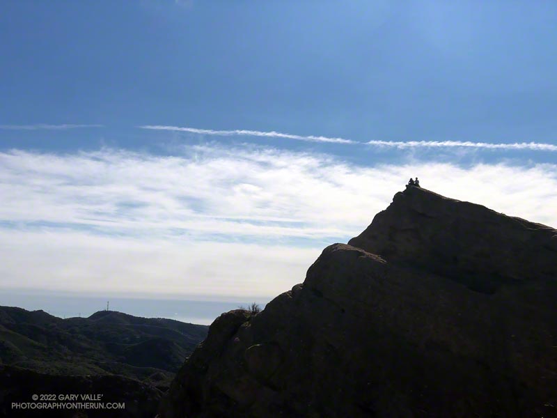 Silhouetted hikers on Eagle Rock in the Santa Monica Mountains