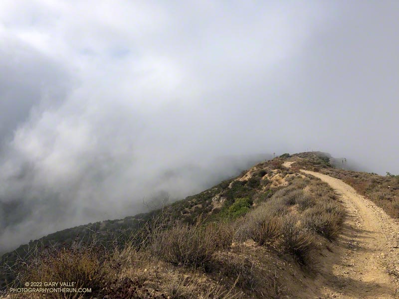 Low clouds spilling over Rocky Peak Road near the Chumash Trail.