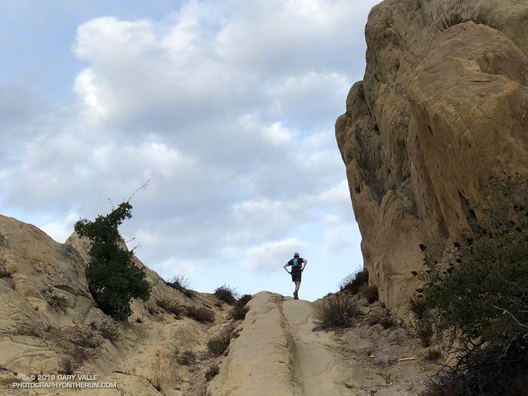 The Backbone Trail passes through a rock gateway in an area of outcrops of Sespe Formation sandstone just east of Corral Canyon.