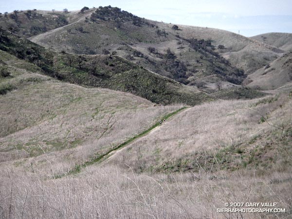 Two runners climb up the last yards of a hill before descending into Las Virgenes Canyon in Upper Las Virgenes Canyon Open Space Preserve.