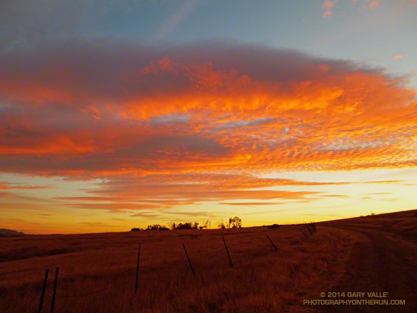 Dissipating wave clouds provide fuel for a fiery sunset