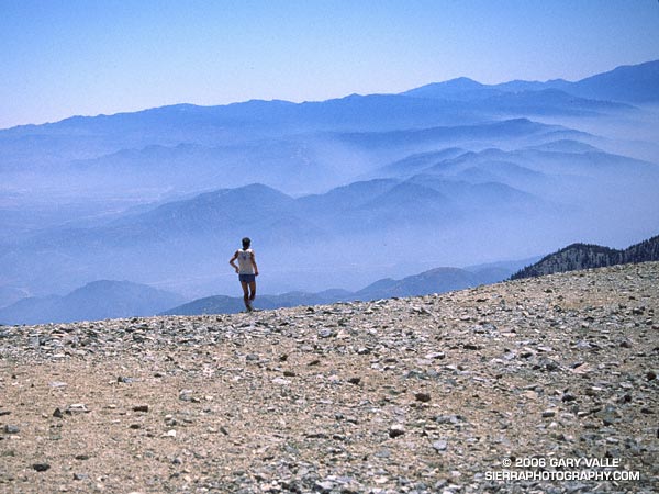 A runner begins the descent from Mt. Baldy.