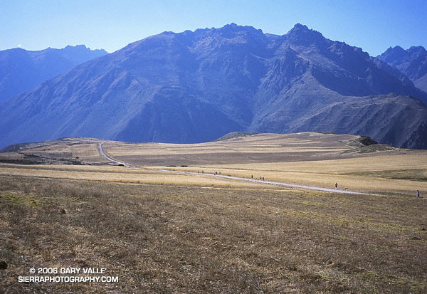 Runners crossing a high plateau in Peru, above the Sacred Valley of the Incas.
