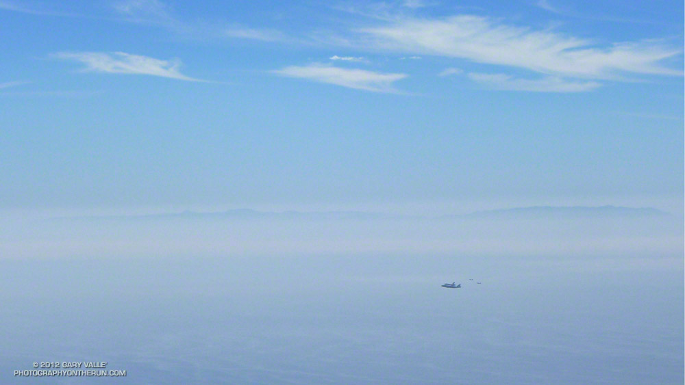 Long (3 mile) shot with a short (90mm) lens. Space Shuttle Endeavour on NASA's 747 Shuttle Carrier Aircraft over the Pacific near Malibu with Catalina Island in the distance. Photographed from Saddle Peak with a Lumix LX7.