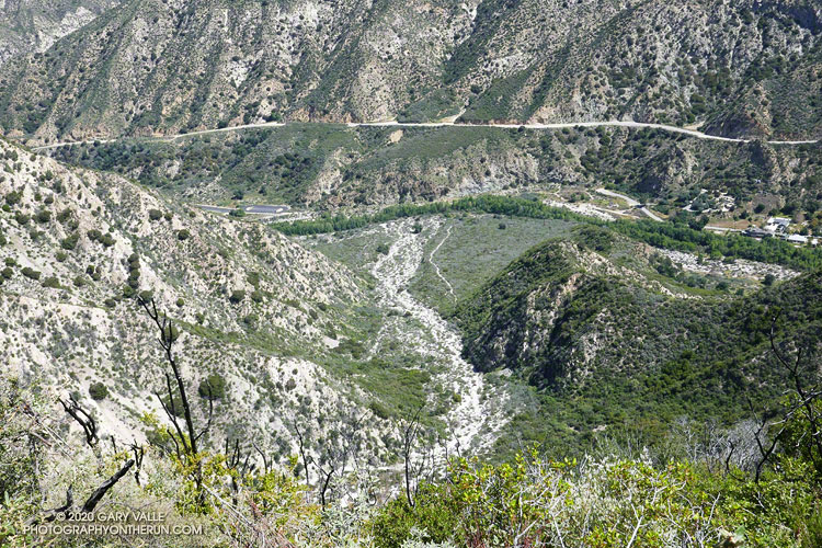A view of Stone Canyon from the Stone Canyon Trail. The Wildwood Picnic Area parking lot is on the left. The band of greenery in the valley delineates Big Tujunga Creek. The Stone Canyon Trail can be seen adjacent to Stone Canyon wash.