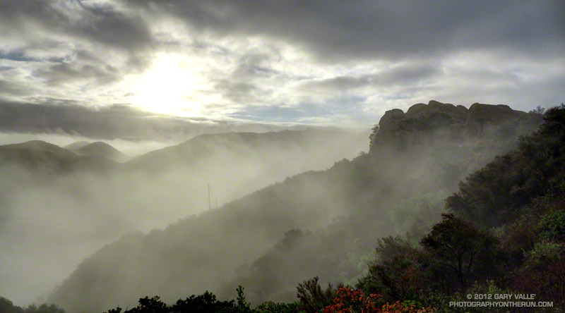 The sun momentarily breaks through the cloud deck on the way up to the Hub in Topanga State Park.