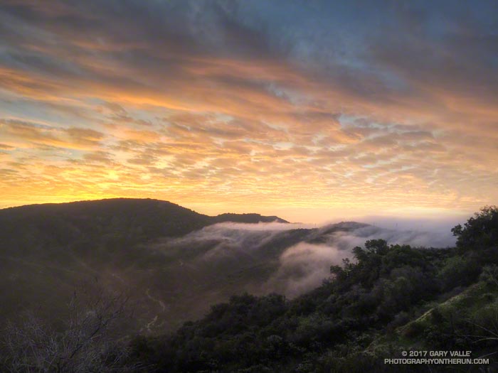 Marine layer spilling over the the crest of the Santa Monica Mountains into Caballero Canyon.