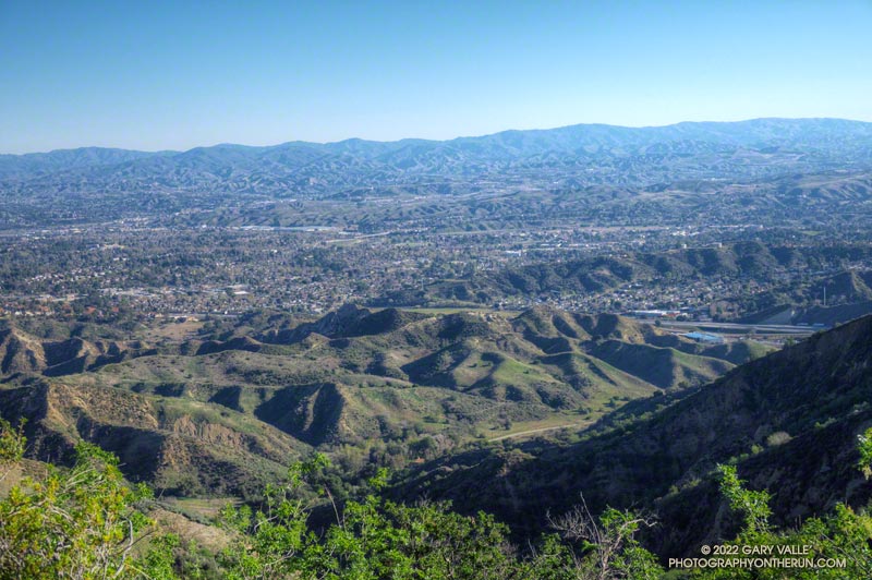Santa Clarita from near the high point of the Towsley Canyon Loop. The high point is on top of the Pico Anticline, a geologic structure that contains oil.  March 6, 2022.