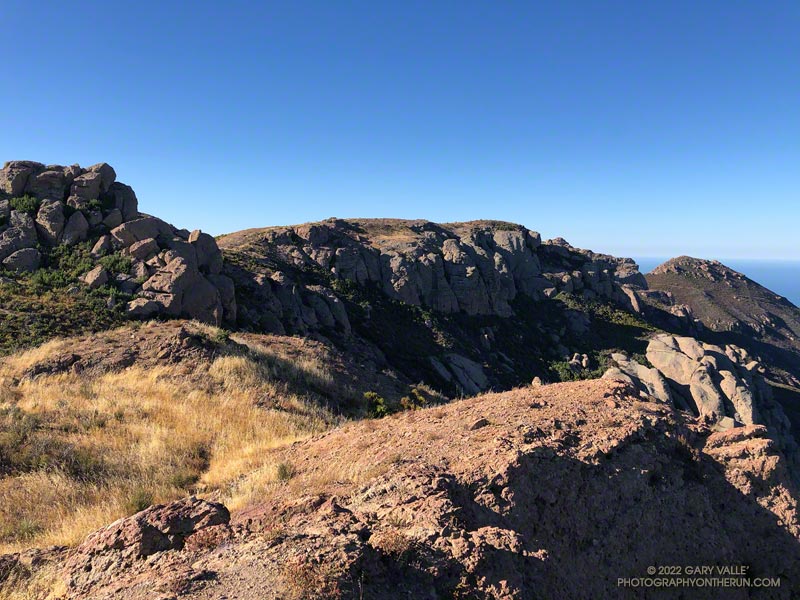 View along the top of Boney Mountain's western escarpment. The Chamberlain segment of the Backbone Trail cuts across the peak on the far right.