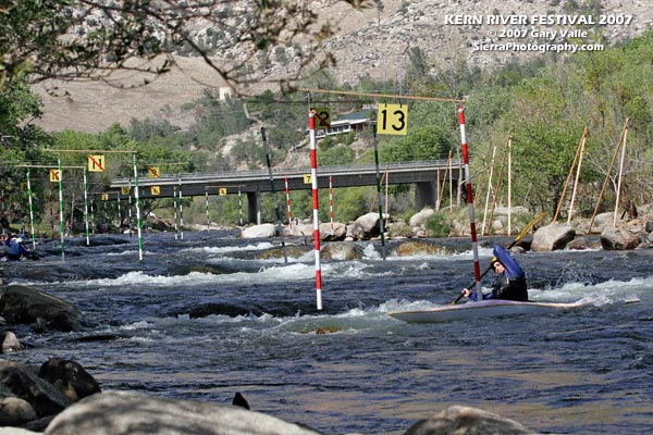 Looking upstream at the 2007 Kern River Festival T.J. Slalom course. A kayaker is turning into upstream gate #13.