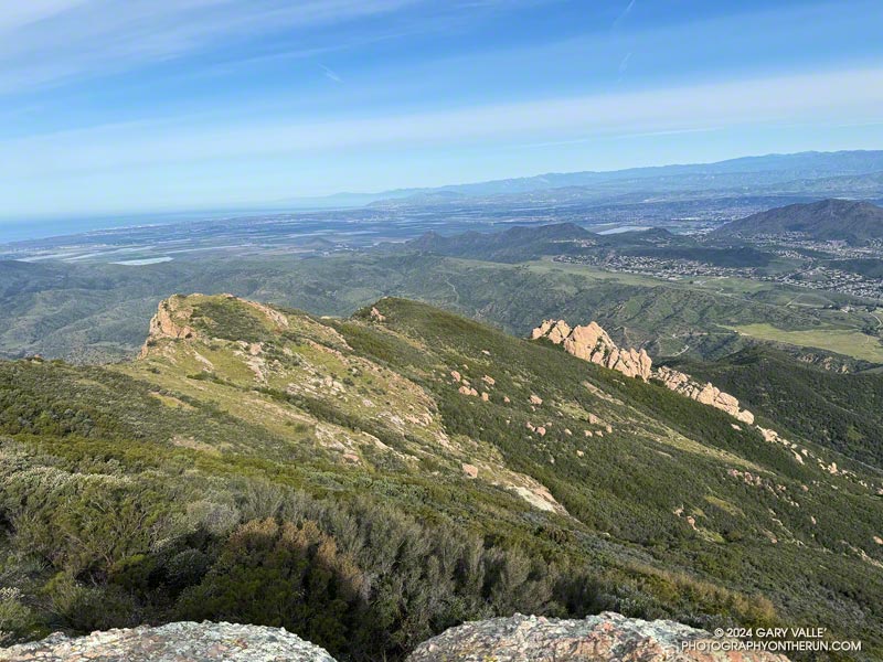 View down the Western Ridge across the Conejo Valley and Oxnard Plain from the high point along the crest on the north side of the Boney Muuntain massif. When people say they are climbing Boney Mountain, this is the point to which they are usually referring. It's 3DEP lidar-based elevation is about 2974 feet.