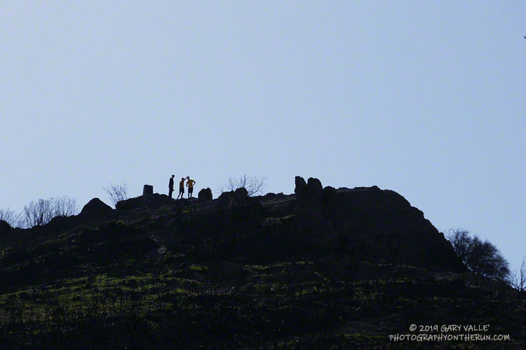 Hikers on the summit of Sandstone Peak (about 3111'). The peak is the highest in the Santa Monica Mountains.