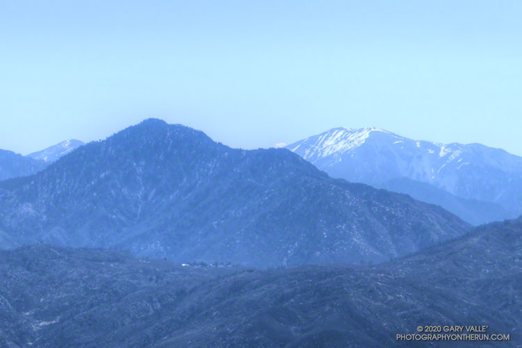 Hazy view of Twin Peaks and snow on  Mt. Baldy from Condor Peak. May 10, 2020.