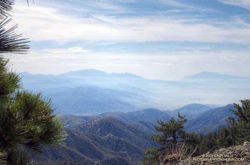 Hazy view of San Gorgonio Mountain and San Jacinto Peak from Baldy's North Backbone trail.