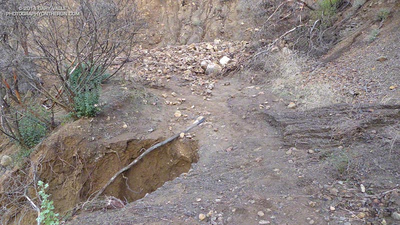 Same debris flow on Danielson Road and erosion of the road. Some gullying of the road occurred earlier this year during storms at the end of February.