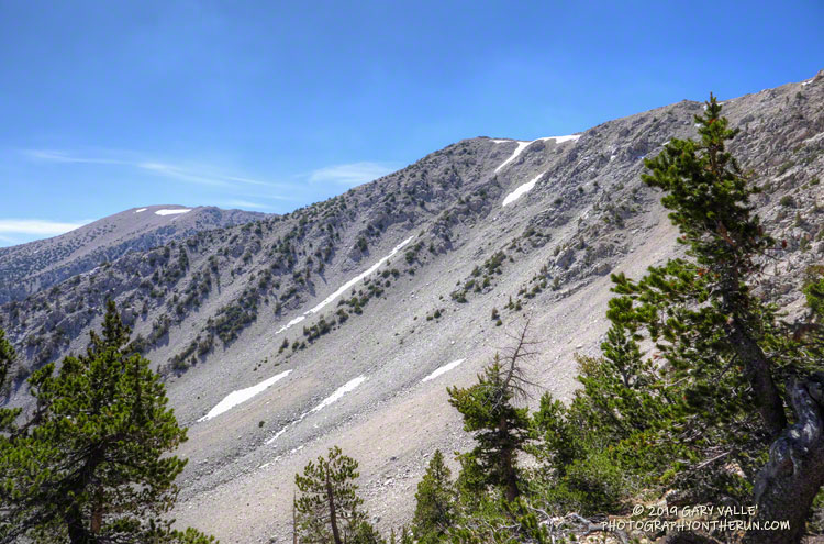 Chutes and a little snow on Jepson Peak. Summit area of San Gorgonio is in the distance on the left. From the San Bernardino Peak Divide Trail. Elevation is about 10, 550'. July 27, 2019.