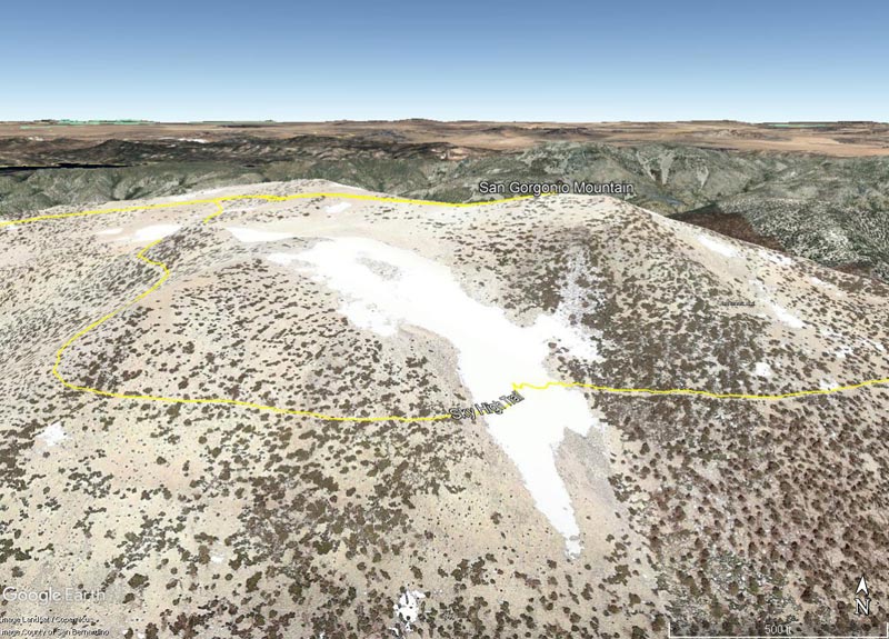 The snow patch was in an area of persistent snow in a broad, shallow, southeast-facing chute that extends to San Gorgonio's summit plateau. This Google Earth image from June 2011 shows the location.