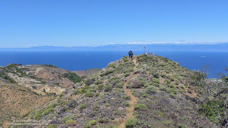 Hikers descending from El Montañon. The ridge continues down and to the left in the photo.