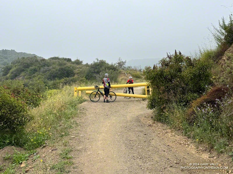 Mountain bikers at the gate at the Camp Josepho junction. This is about 3.5 miles from Mulholland and 6 miles from the trailhead at the Top of Reseda.