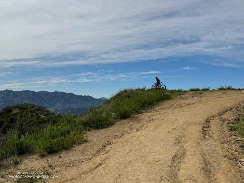 Mountain biker enjoying the view on Eagle Rock Fire Road, between the Musch Trail and Eagle Rock.