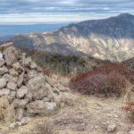 Cairn, with summit register, on Brown Mountain with Mt. Lukens in the background